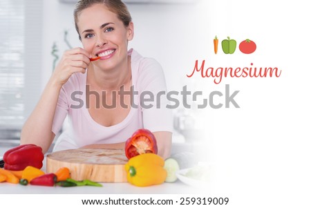 The word magnesium against cheerful woman eating vegetables