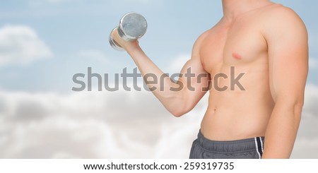 Strong man lifting dumbbell with no shirt on against cloudy sky