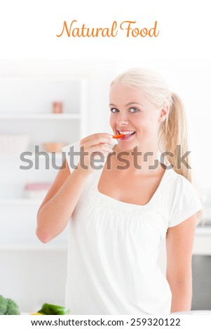 The word natural food against woman eating a slice of pepper