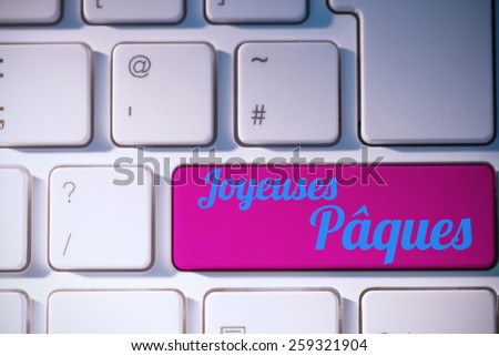 joyeuses paques against pink key on keyboard