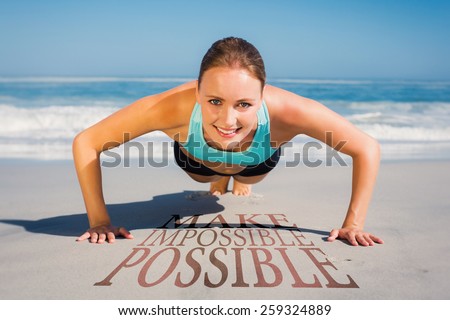 Fit woman in plank position on the beach against make impossible possible