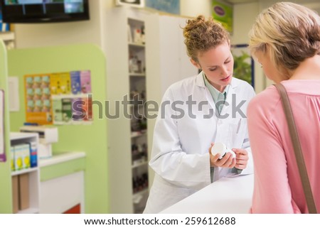 Pharmacist and her customer talking about medication in the pharmacy