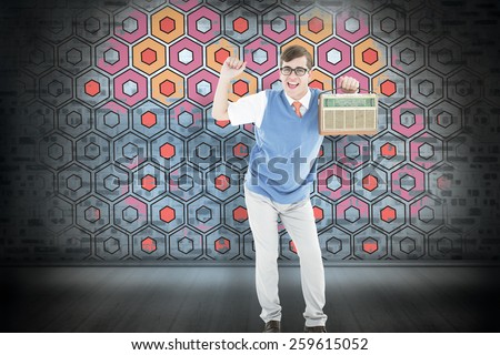 Geeky hipster listening to retro radio against blue background with vignette