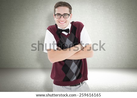Smiling geeky hipster looking at camera against green vignette