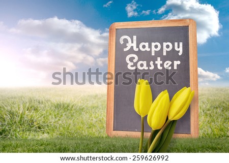 Yellow tulips against chalkboard with chalk