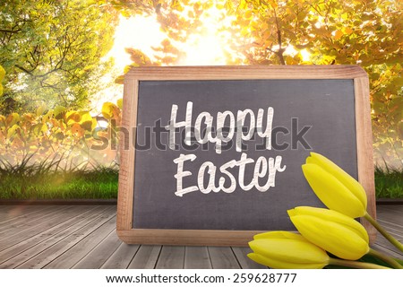 Yellow tulips against chalkboard with chalk