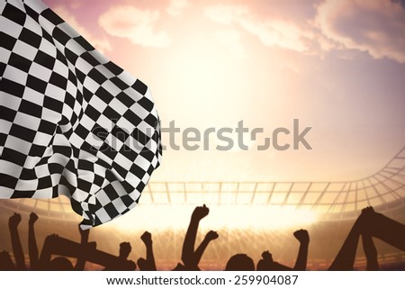 Checkered flag against football stadium with cheering crowd