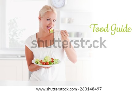 The word food guide against blonde woman eating a salad