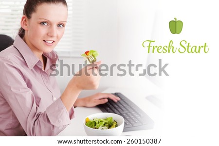 The word fresh start against businesswoman in office eating salad