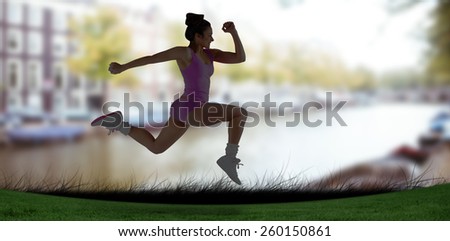 Fit brunette running and jumping against sun shining over park