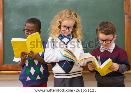 Pupils reading books at elementary school