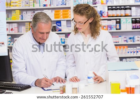 Team of pharmacist looking a medication for a prescription at hospital pharmacy