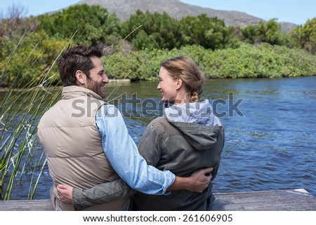 Happy couple at a lake in the countryside