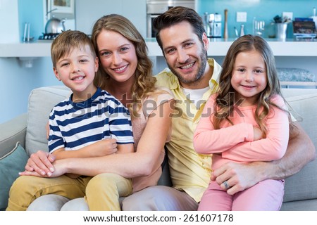Happy family on the couch at home in the living room