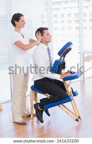 Businessman having head massage in medical office