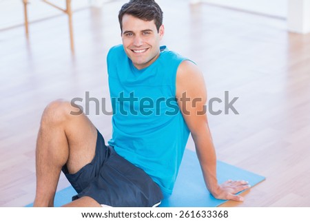 Smiling patient looking at camera in fitness studio