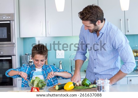 Happy family preparing lunch together at home in the kitchen