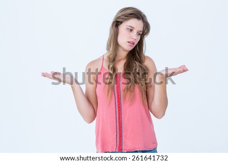 Unsure woman gesturing do not know sign on white background
