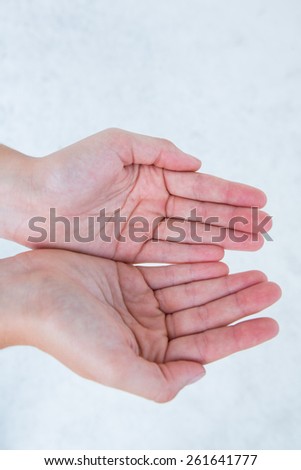 Woman showing her hands on white background