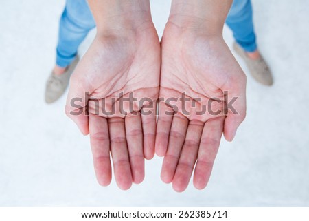 Woman showing her hands on white background