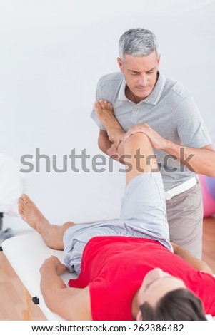 Man having leg massage in medical office