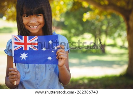Cute little girl with australian flag on a sunny day