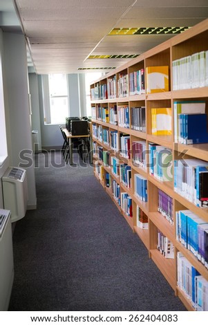 Volumes of books on bookshelf in library at the university