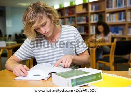 Student studying in the library at the university