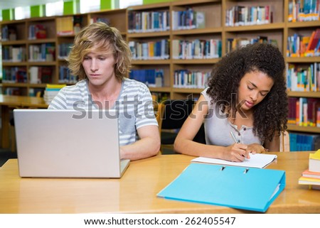 Students studying together in the library at the university
