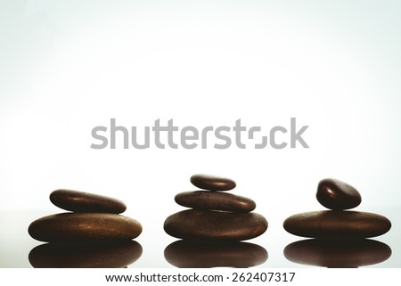 Zen stones balancing on white background shot in studio
