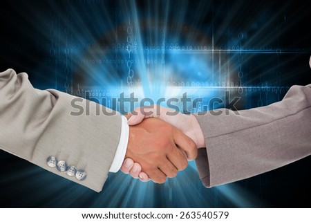 Side view of shaking hands against black technology design with glow
