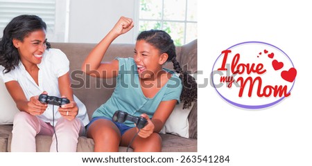 mothers day greeting against happy mother and daughter playing video games together on sofa