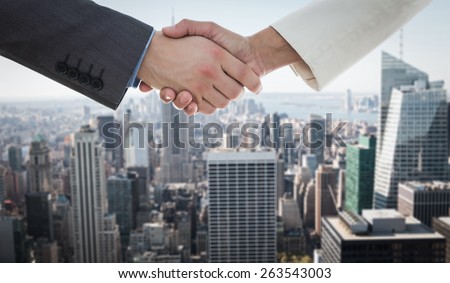 Shaking hands over eye glasses and diary after business meeting against new york