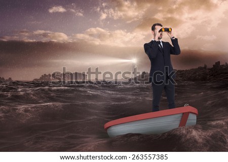 Businessman in boat with binoculars against stormy sea with lighthouse