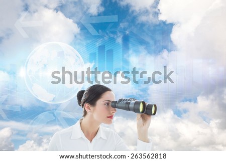 Business woman looking through binoculars against global business graphic in blue