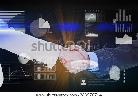 Smiling business people shaking hands while looking at the camera against abstract technology interface