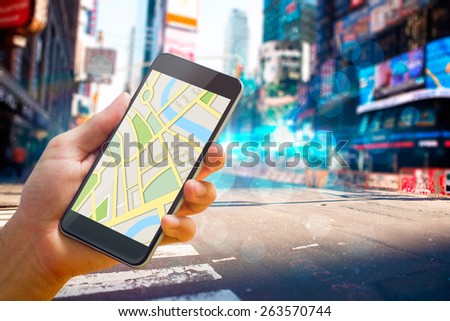 Man using map app on phone against blurry new york street