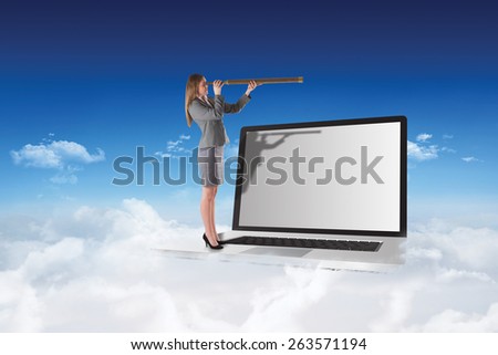 Businesswoman looking through a telescope against bright blue sky over clouds