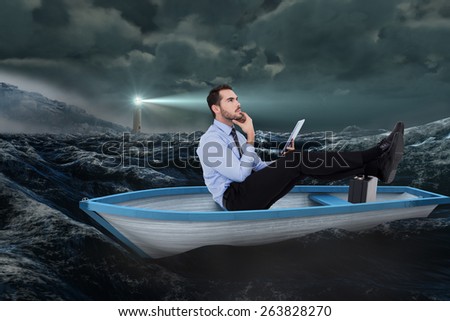 Businessman in boat with tablet pc against stormy sea with lighthouse