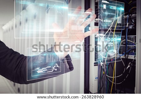 Businessman holding hand out in presentation against data center