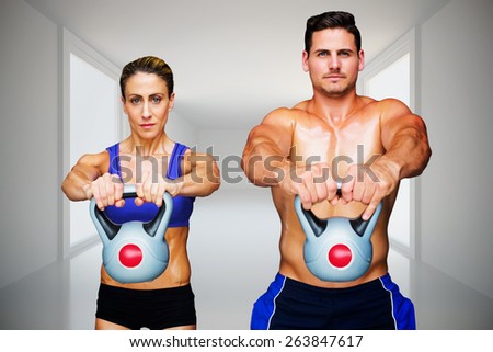 Bodybuilding couple against digitally generated room