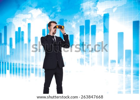 Elegant businessman standing and using binoculars against global business graphic in blue