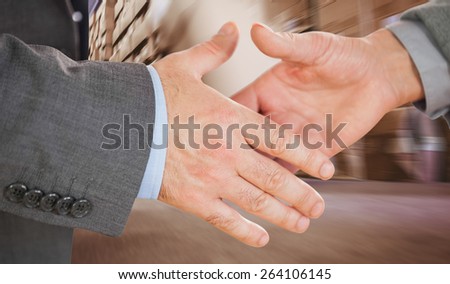 Two people going to shake their hands against worker with fork pallet truck stacker in warehouse