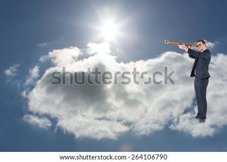 Businessman looking through telescope against blue sky with clouds and sun