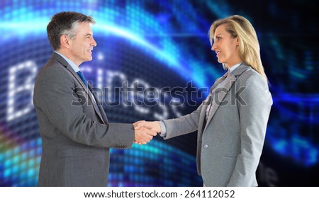 Pleased businessman shaking the hand of content businesswoman against business online on digital screen