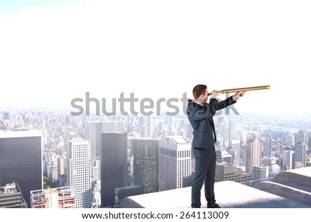 Businessman looking through telescope against high angle view of city