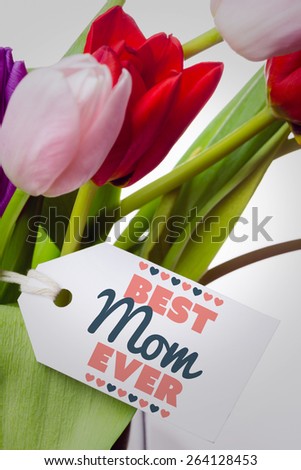 best mom ever against tulips with note