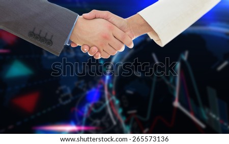 Shaking hands over eye glasses and diary after business meeting against stocks and shares