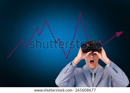 Suprised businessman looking through binoculars against digitally generated grey background