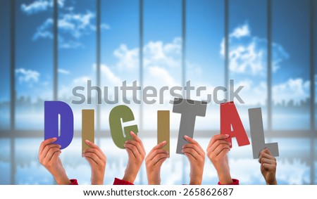 hands showing digital against room with large window looking on city skyline